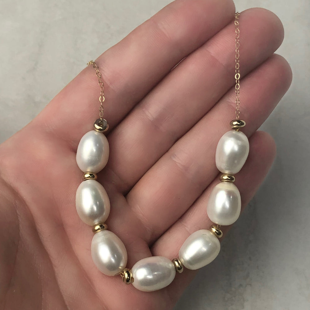 
                  
                    Seven Pearl Necklace
                  
                